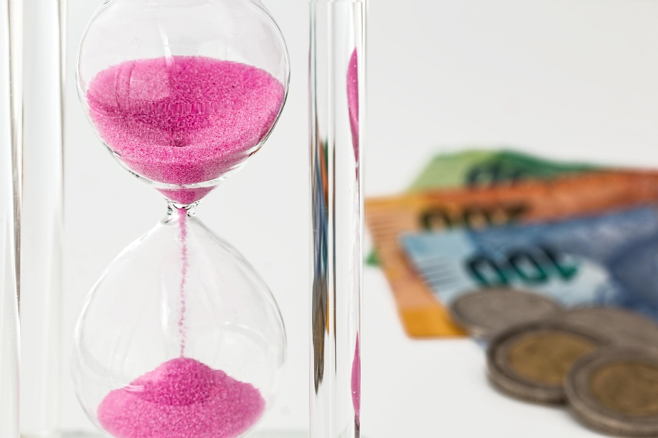 Hourglass, money, time — Atomic Wallet: The Essential Tool for Your Crypto Journey