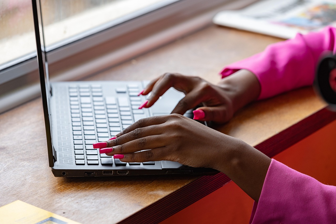Laptop, typing, working — Maximizing Profits with Jupiter Swap: A Trader's Guide